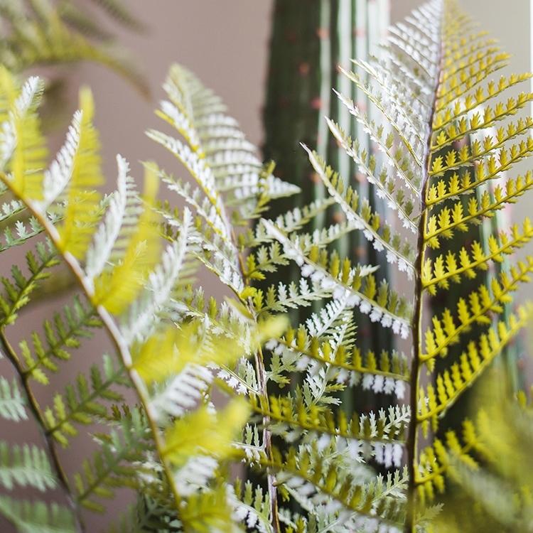 A realistic Artificial Faux Cyathea Tree in a decorative pot, showcasing lush green leaves and a sturdy base, perfect for home decor.