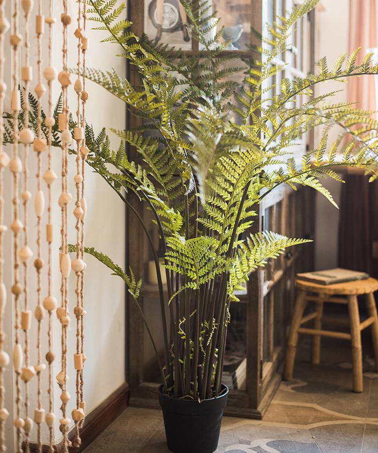 A realistic Artificial Faux Cyathea Tree in a decorative pot, showcasing lush green leaves and a sturdy base, perfect for home decor.