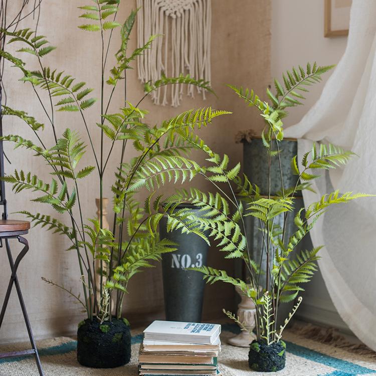 Artificial Faux Eagle Fern Bulk Plant in vibrant green with a sturdy black base, showcasing realistic leaves and textures.