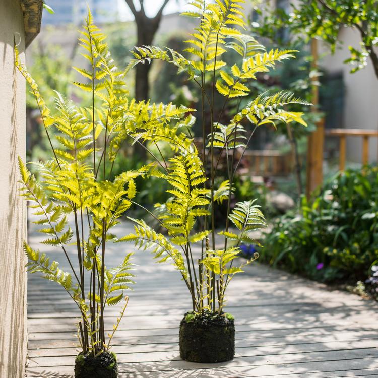 Artificial Faux Eagle Fern Bulk Plant in vibrant green with a sturdy black base, showcasing realistic leaves and textures.