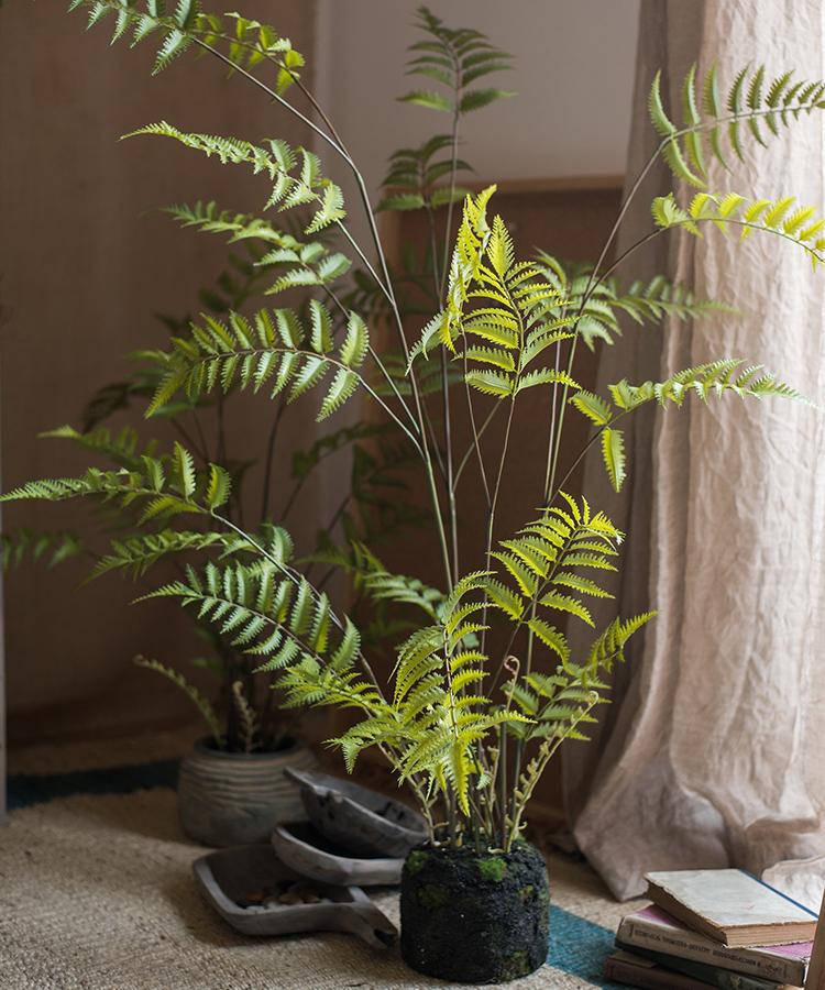 Artificial Faux Eagle Fern Bulk Plant in vibrant green with a sturdy black base, showcasing realistic leaves and textures.