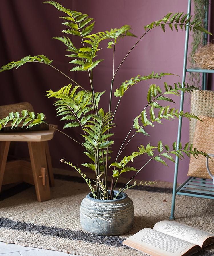 Artificial Faux Eagle Fern Bulk Plant in vibrant green with a sturdy black base, showcasing realistic leaves and textures.