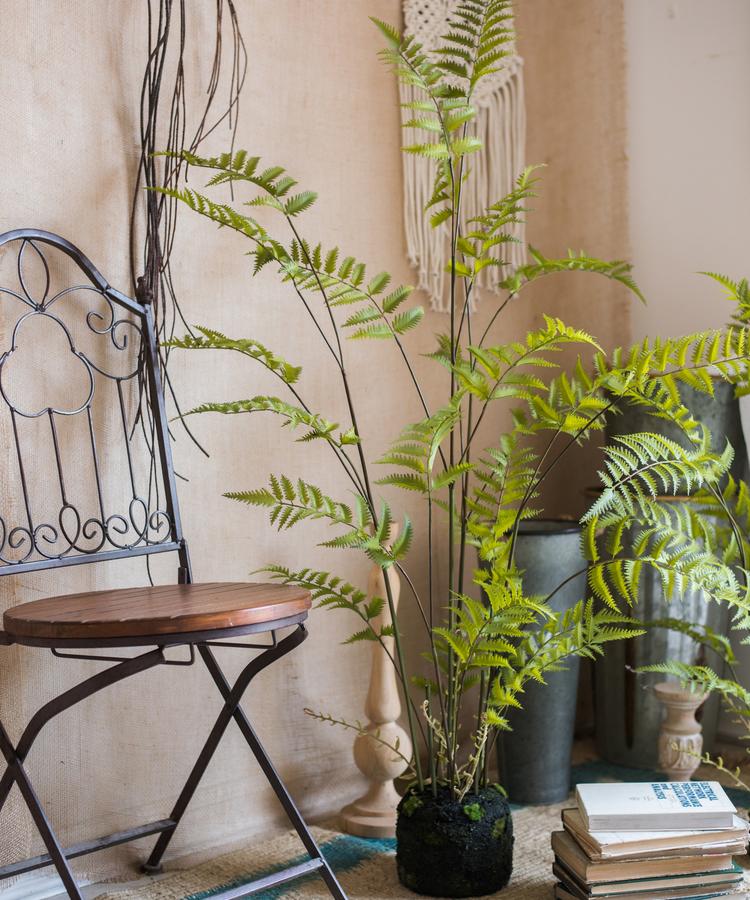 Artificial Faux Eagle Fern Bulk Plant in vibrant green with a sturdy black base, showcasing realistic leaves and textures.