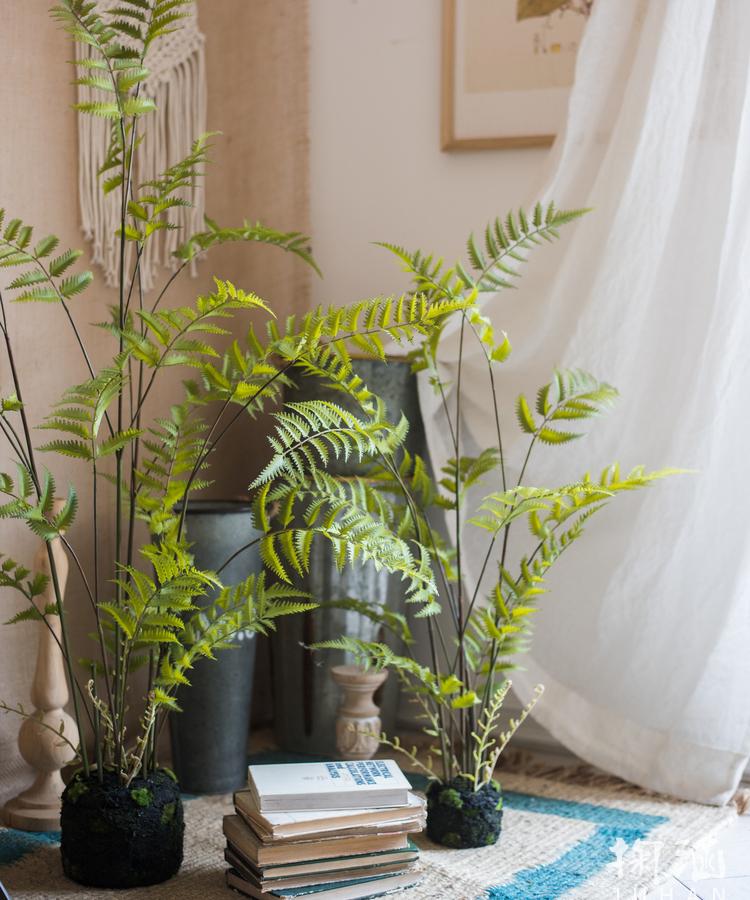 Artificial Faux Eagle Fern Bulk Plant in vibrant green with a sturdy black base, showcasing realistic leaves and textures.