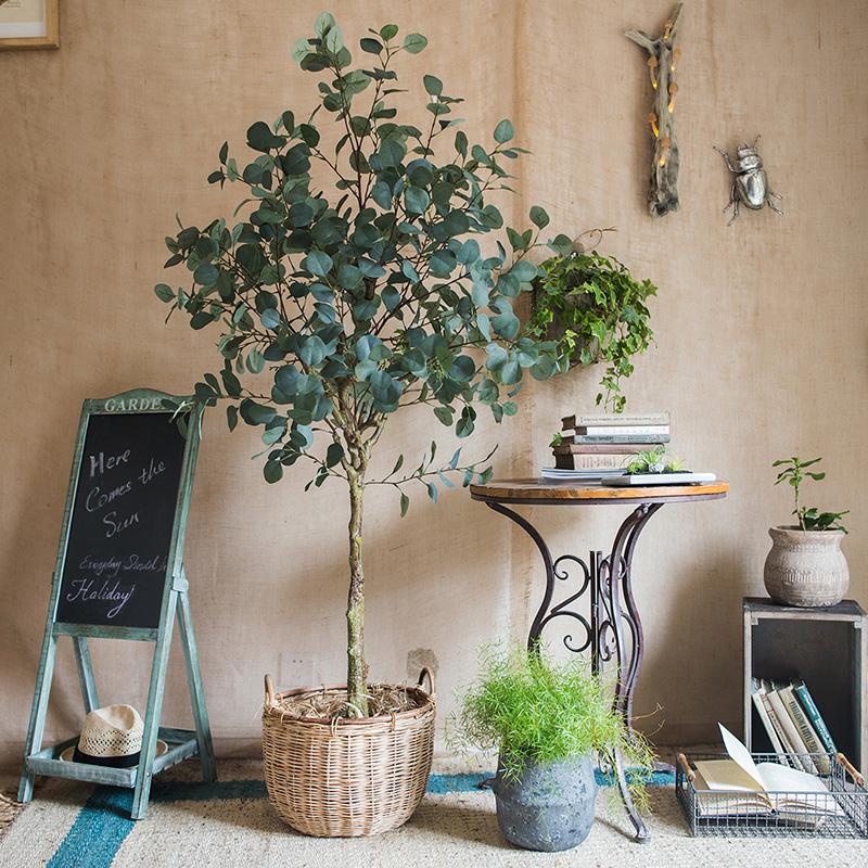 Artificial Faux Eucalyptus Tree in a black pot, showcasing realistic green leaves and a stylish design for home decor.