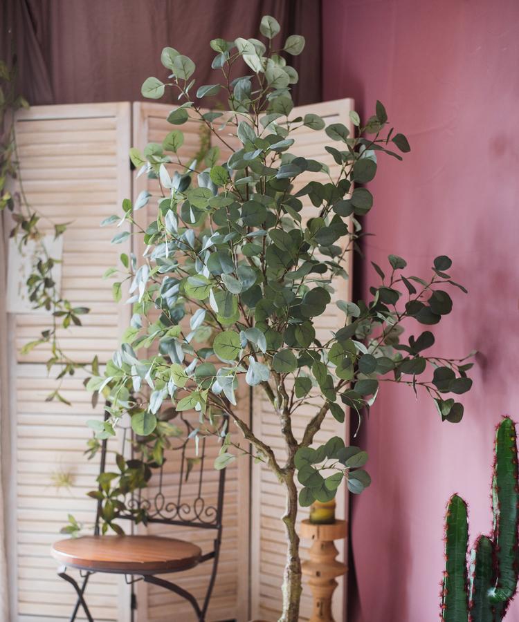 Artificial Faux Eucalyptus Tree in a black pot, showcasing realistic green leaves and a stylish design for home decor.