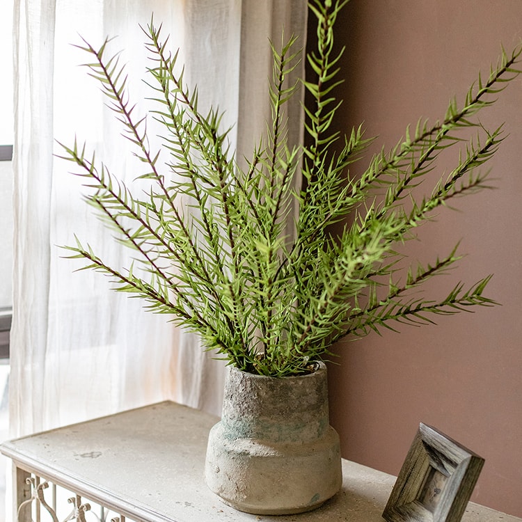 A tall 48-inch artificial faux flax grass stem in vibrant green, showcasing realistic leaves and stems, perfect for home or office decor.