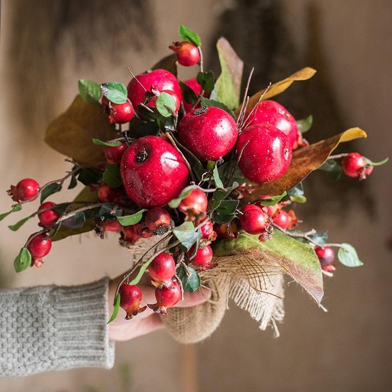 A vibrant 12-inch tall artificial bouquet featuring faux apples and pomegranates in red and green colors, perfect for home decor.