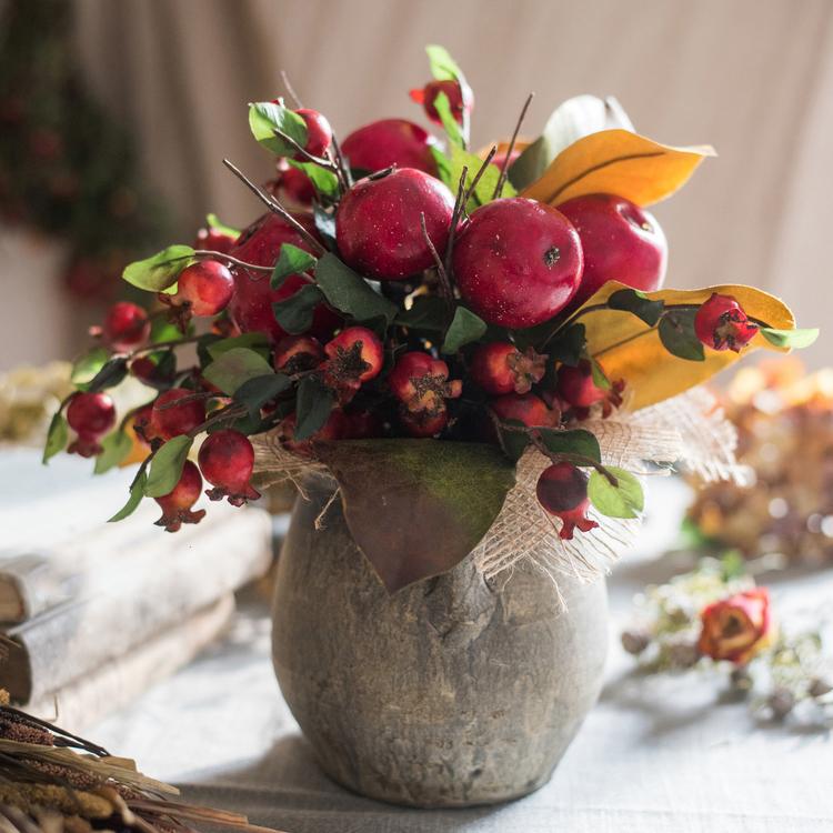 A vibrant 12-inch tall artificial bouquet featuring faux apples and pomegranates in red and green colors, perfect for home decor.