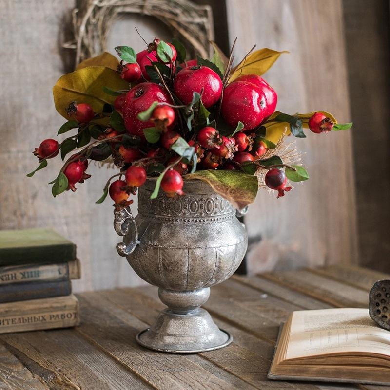 A vibrant 12-inch tall artificial bouquet featuring faux apples and pomegranates in red and green colors, perfect for home decor.