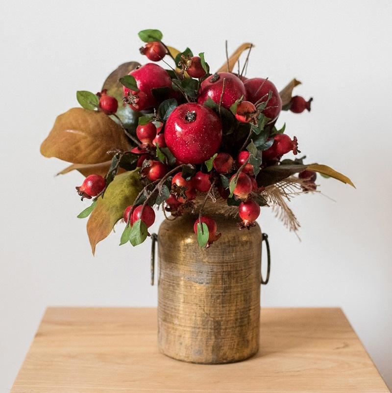 A vibrant 12-inch tall artificial bouquet featuring faux apples and pomegranates in red and green colors, perfect for home decor.