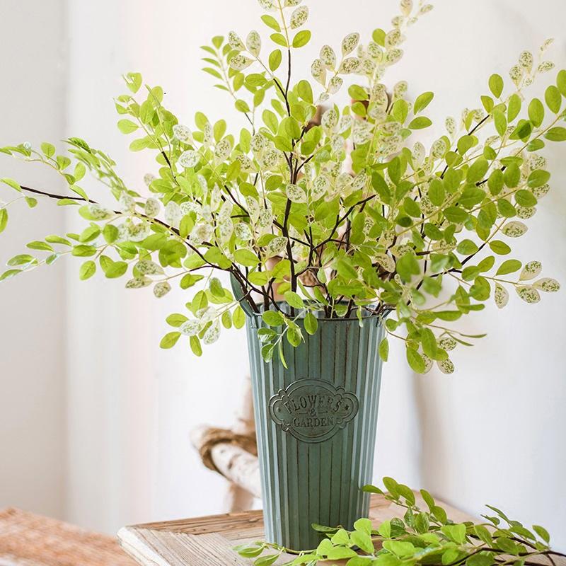 A tall 37-inch artificial faux plant with fresh spring leaf stems in vibrant green and white colors, perfect for home or office decor.