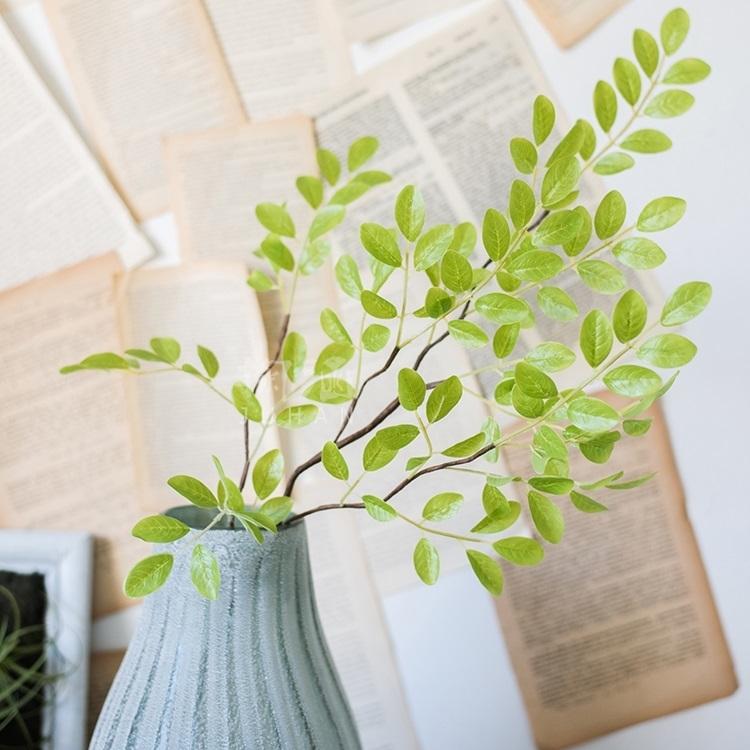 A tall 37-inch artificial faux plant with fresh spring leaf stems in vibrant green and white colors, perfect for home or office decor.