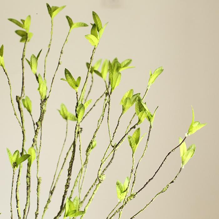 A tall 37-inch artificial faux plant with lush green leaves and a stylish rattan stem, perfect for home decor.