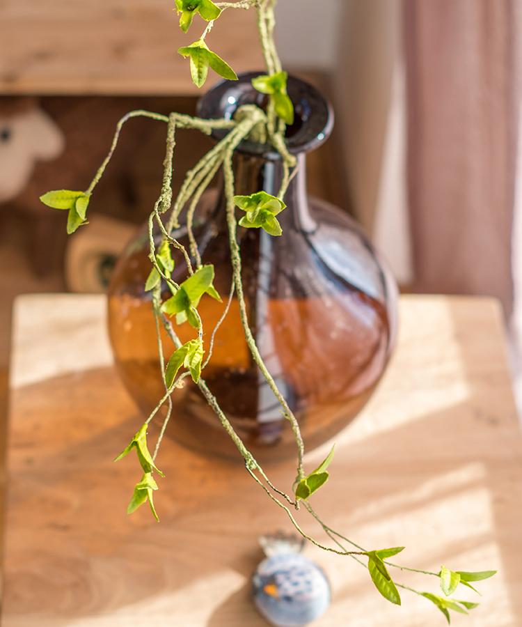 A tall 37-inch artificial faux plant with lush green leaves and a stylish rattan stem, perfect for home decor.