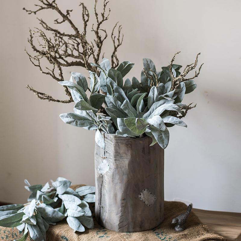 A collection of Artificial Faux Plant Wild Leaf Stems in varying heights, showcasing realistic green and gray silk leaves.