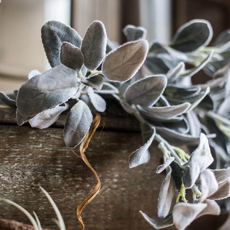 A collection of Artificial Faux Plant Wild Leaf Stems in varying heights, showcasing realistic green and gray silk leaves.