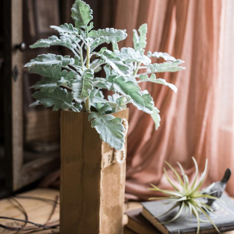 A collection of Artificial Faux Plant Wild Leaf Stems in varying heights, showcasing realistic green and gray silk leaves.