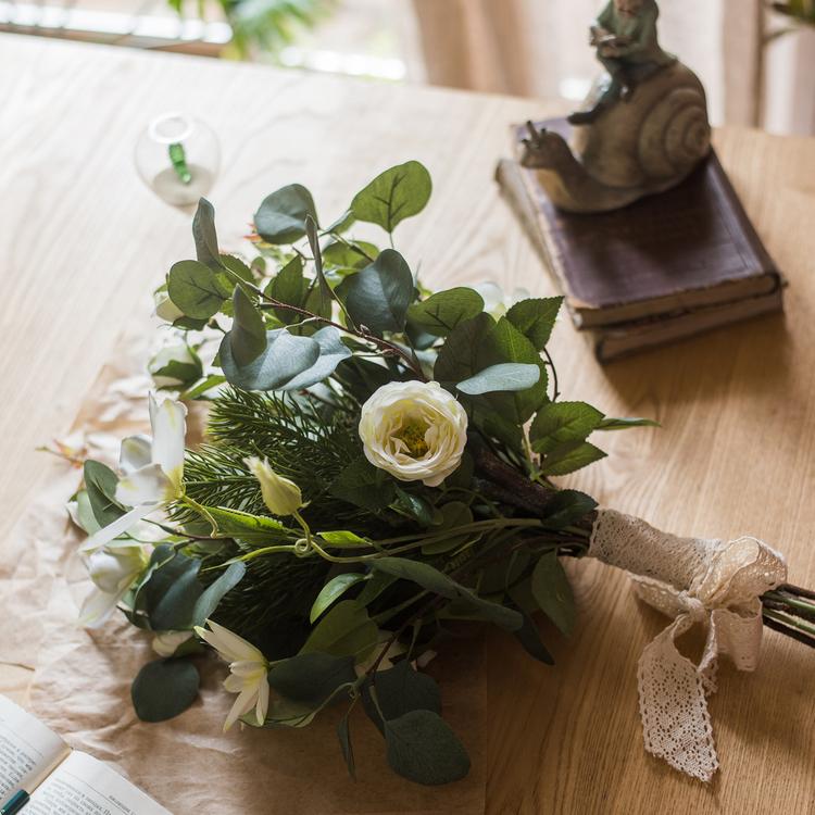 A vibrant 20-inch tall artificial flower bouquet featuring Clematis flowers and lush greenery, perfect for home decor.