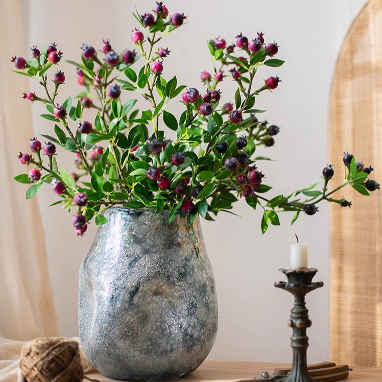 A tall 22.4-inch artificial blueberry stem featuring vibrant blue berries and lush green leaves, perfect for home decor.