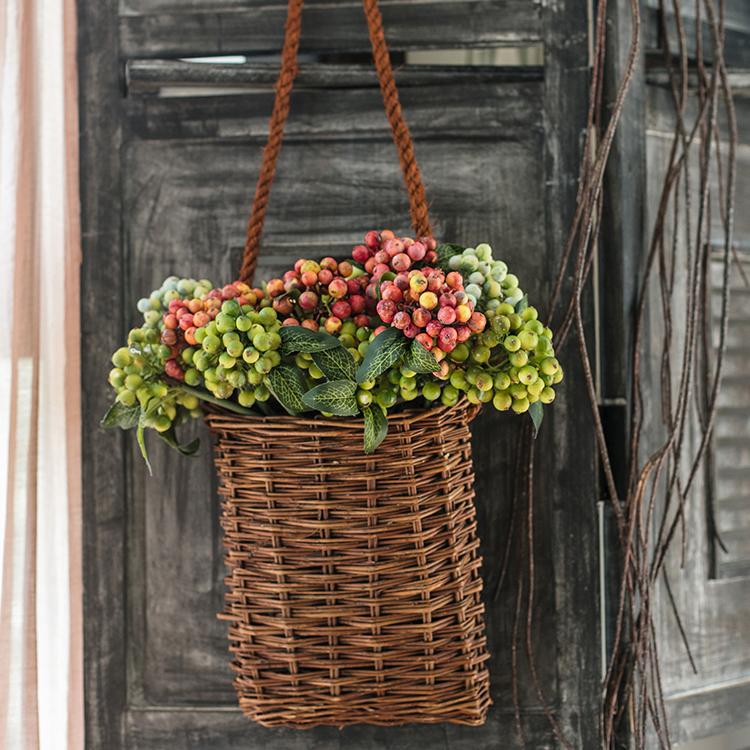 A vibrant 11-inch tall artificial fruit berry bunch featuring orange, red, and green colors, perfect for home and wedding decor.