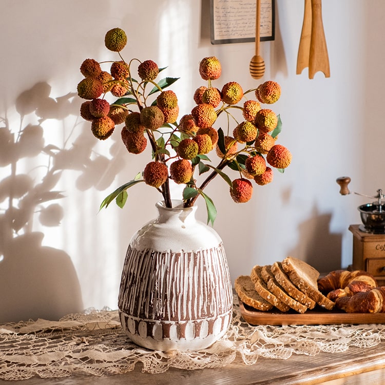 A 27-inch tall artificial lychee stem silk plant featuring vibrant yellow and red colors, designed for home and office decor.