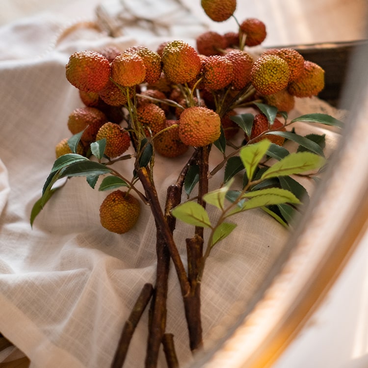 A 27-inch tall artificial lychee stem silk plant featuring vibrant yellow and red colors, designed for home and office decor.