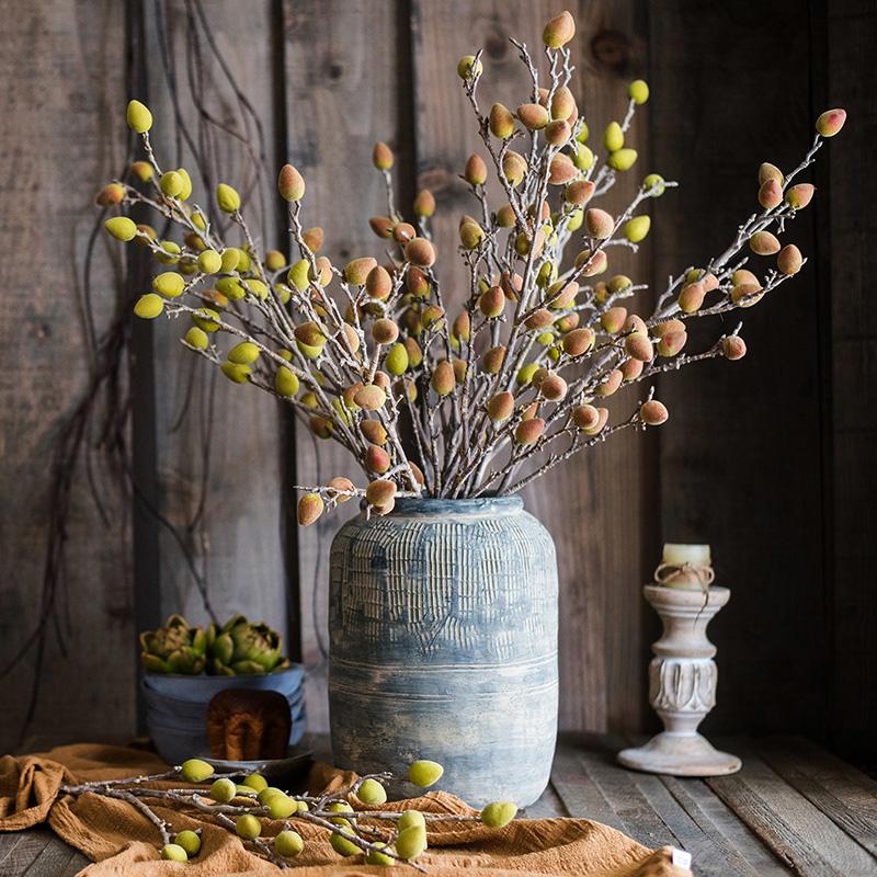 A 40-inch tall artificial Mountain Peach silk plant with vibrant green and red-green colors, showcasing realistic fruit details.