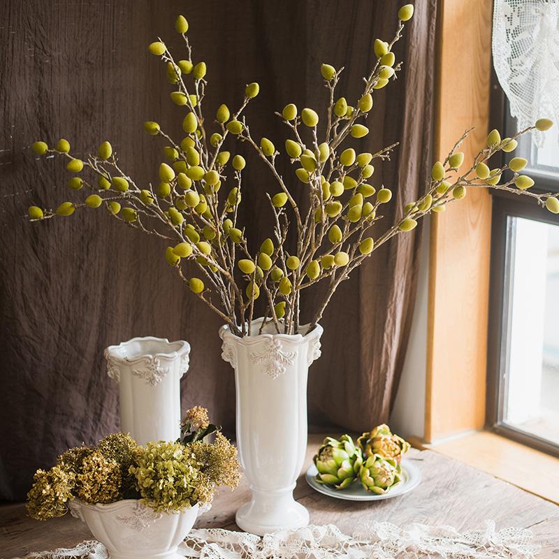 A 40-inch tall artificial Mountain Peach silk plant with vibrant green and red-green colors, showcasing realistic fruit details.