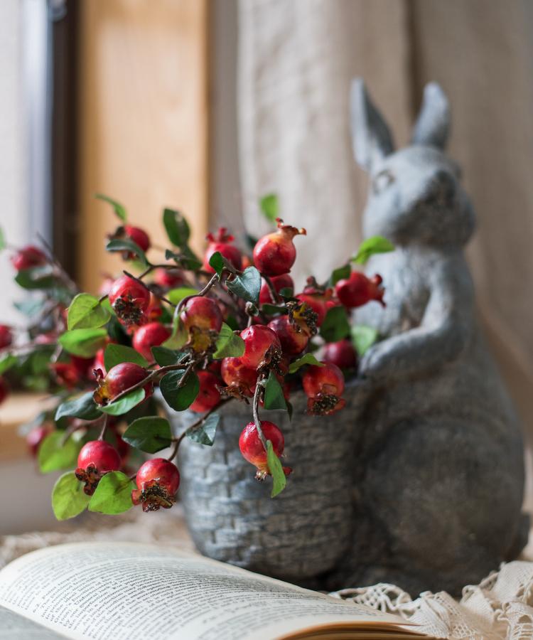 A vibrant 12-inch tall artificial pomegranate fruit bouquet featuring realistic red pomegranates and green leaves, perfect for home decor.