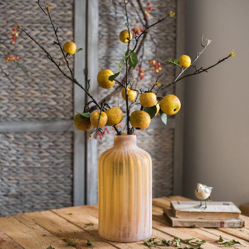 A 27-inch tall artificial fruit stem featuring four realistic yellow apple pears with green accents, perfect for home decor.