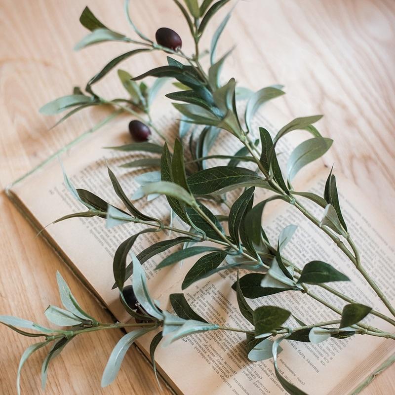 A 41-inch tall artificial olive stem featuring realistic green and black olives, perfect for home decor.