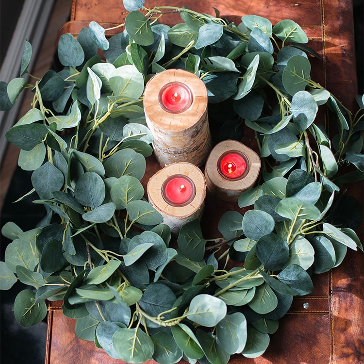 A long artificial green eucalyptus vine, 70 inches, with realistic silk leaves, perfect for home and event decor.