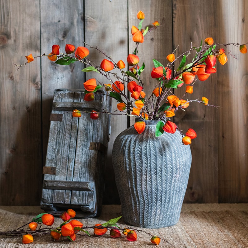 Artificial Makino Fruit Stem in vibrant orange-red, 39 inches tall, featuring realistic silk leaves and fruit.