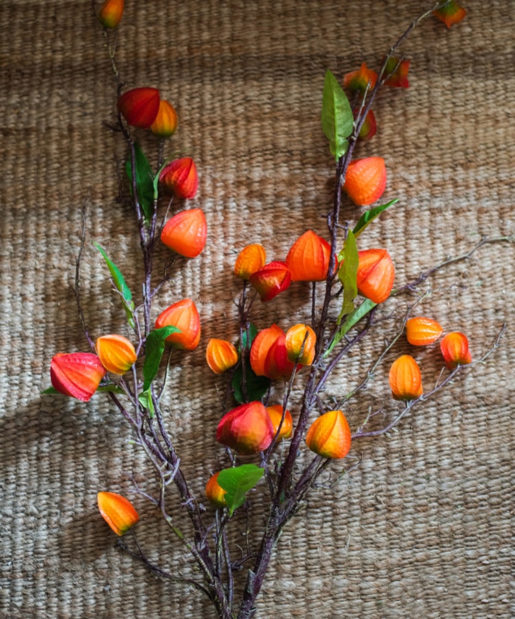 Artificial Makino Fruit Stem in vibrant orange-red, 39 inches tall, featuring realistic silk leaves and fruit.