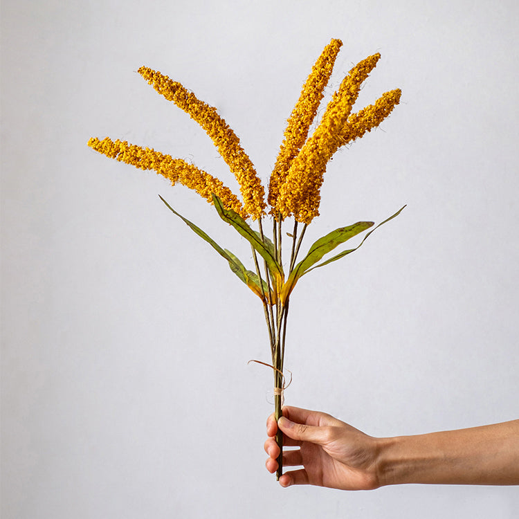 A 19-inch tall artificial millet bundle featuring vibrant brown, orange-brown, yellow, and green leaves, perfect for home decor.