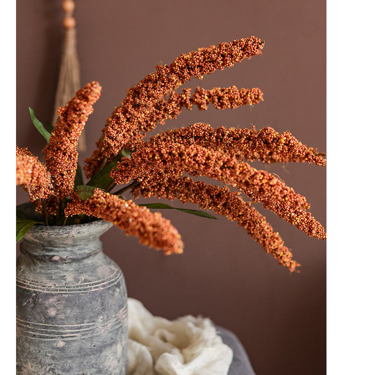 A 19-inch tall artificial millet bundle featuring vibrant brown, orange-brown, yellow, and green leaves, perfect for home decor.