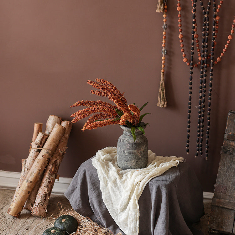 A 19-inch tall artificial millet bundle featuring vibrant brown, orange-brown, yellow, and green leaves, perfect for home decor.