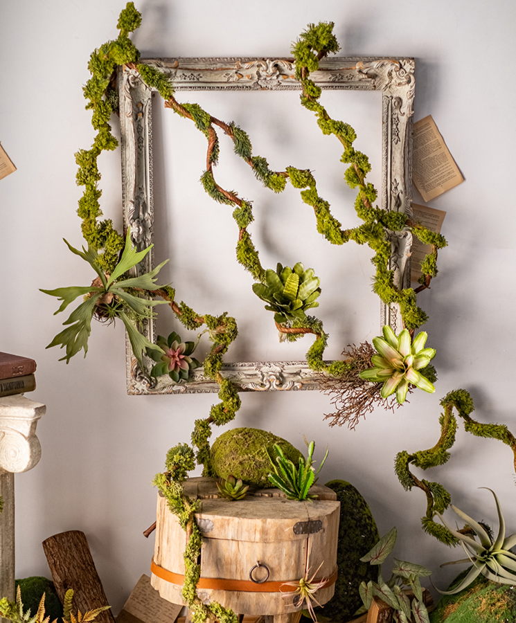 Artificial Moss Rattan Vine in green and brown, showcasing its realistic faux moss and rattan design, perfect for home decor.