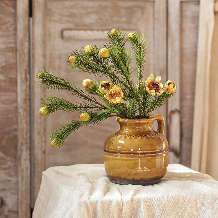 A 26-inch tall artificial pine needle flower stem in mixed colors, showcasing realistic details and vibrant hues.