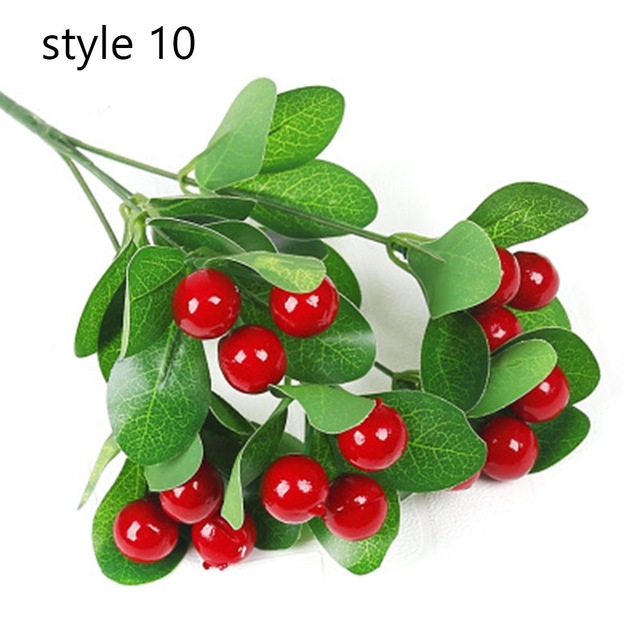 Artificial red berries and green leaves.