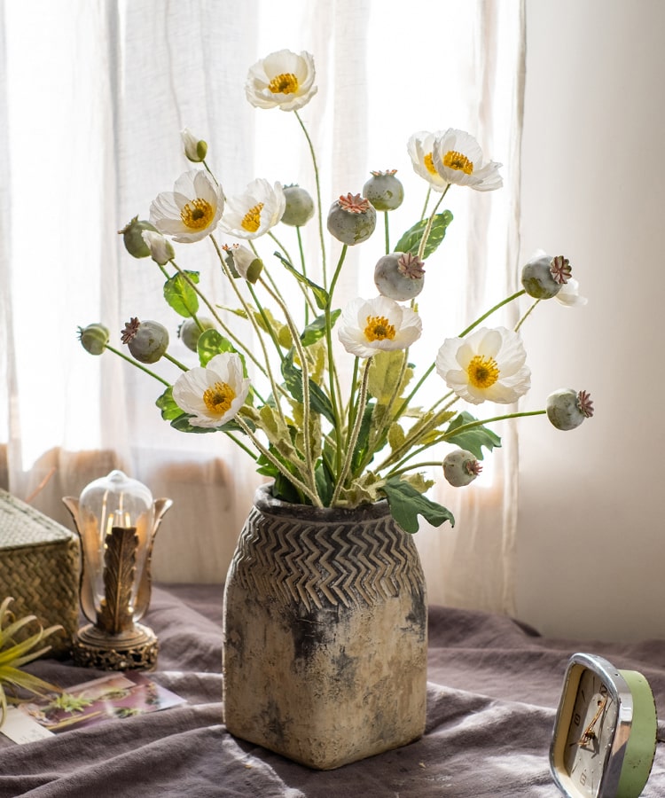 A 23.6-inch tall artificial poppy fruit stem with vibrant frosted green, purple, and yellow colors, featuring four realistic fruits on a sturdy stem.