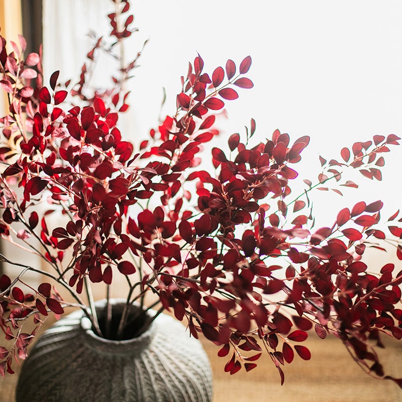 42-inch tall Artificial Red Tzu Tan Leaf Stem with vibrant red leaves and sturdy stem, perfect for home or office decor.