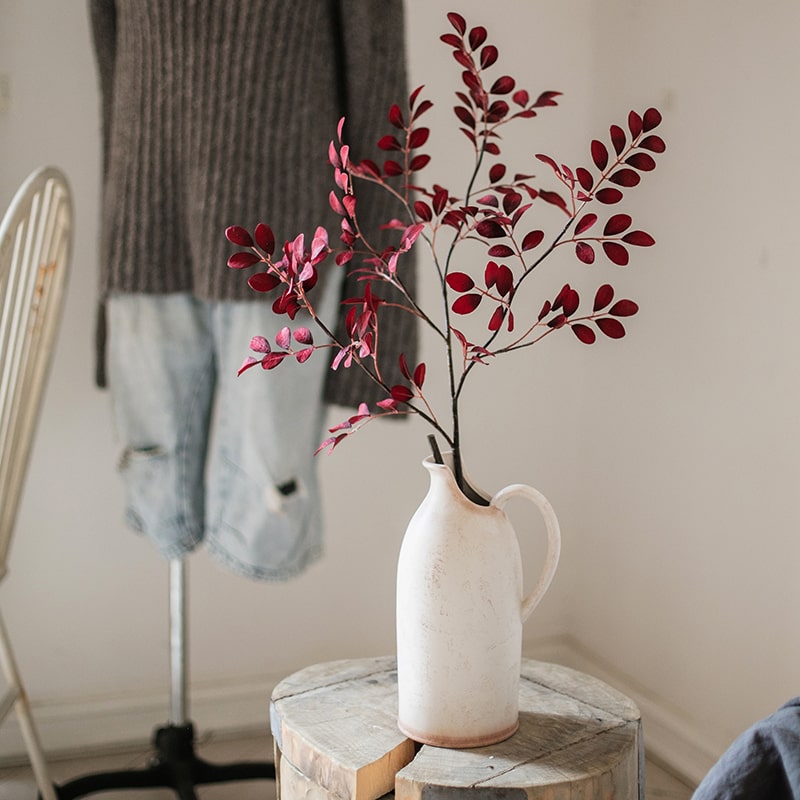 42-inch tall Artificial Red Tzu Tan Leaf Stem with vibrant red leaves and sturdy stem, perfect for home or office decor.