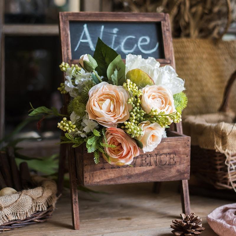 A beautiful 12-inch tall artificial silk flower bouquet featuring champagne roses, dahlias, and greenery, perfect for home decor and events.