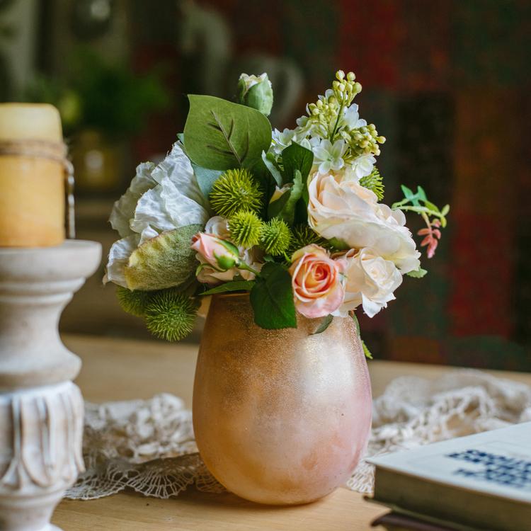 A beautiful 12-inch tall artificial silk flower bouquet featuring champagne roses, dahlias, and greenery, perfect for home decor and events.