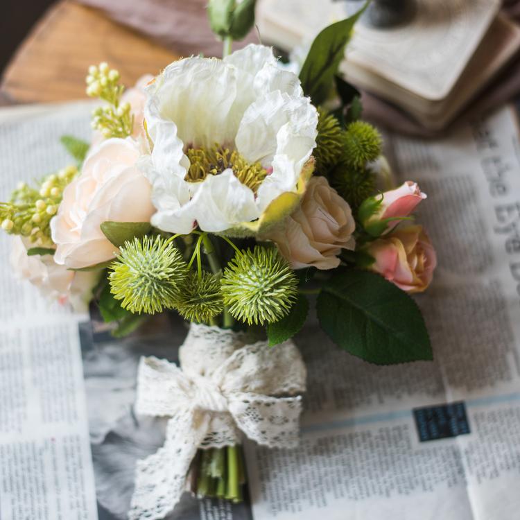 A beautiful 12-inch tall artificial silk flower bouquet featuring champagne roses, dahlias, and greenery, perfect for home decor and events.