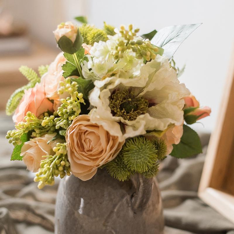 A beautiful 12-inch tall artificial silk flower bouquet featuring champagne roses, dahlias, and greenery, perfect for home decor and events.