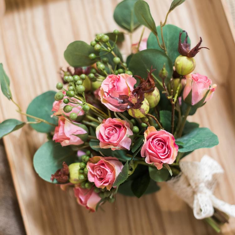 A beautiful 12-inch tall artificial silk flower bouquet featuring pink roses and lush greenery, perfect for home decor.