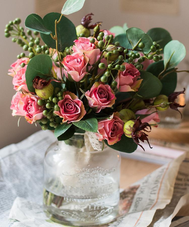 A beautiful 12-inch tall artificial silk flower bouquet featuring pink roses and lush greenery, perfect for home decor.